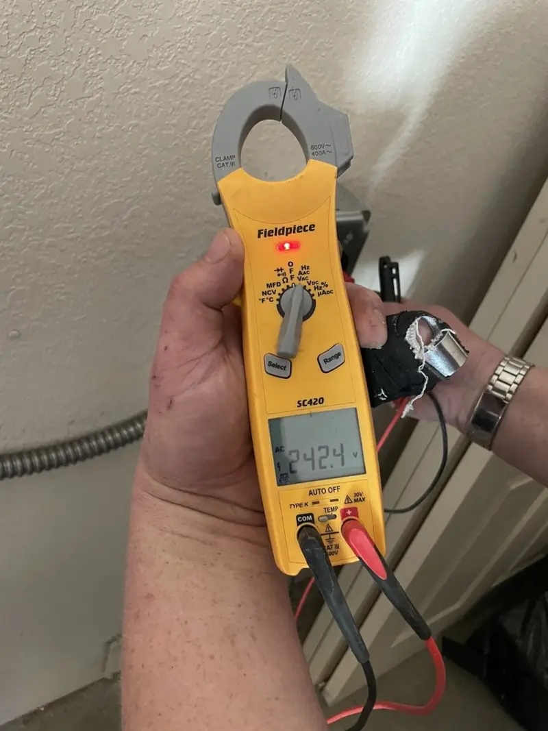Voltage testing with clamp meter during Whole House Surge Protector in Ross